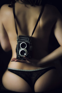 sexting nude photos naked back of women holding vintage camera